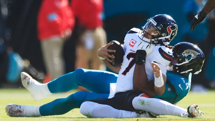 Jacksonville Jaguars defensive end Travon Walker (44) sacks Houston Texans quarterback C.J. Stroud (7) during the first quarter of an NFL football matchup Sunday, Dec. 1, 2024 at EverBank Stadium in Jacksonville, Fla. [Corey Perrine/Florida Times-Union]