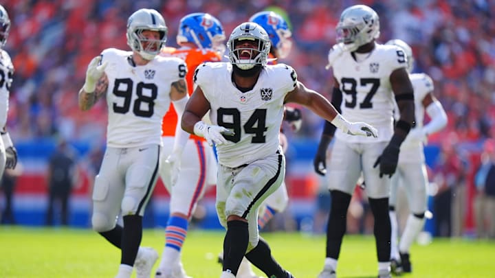 Oct 6, 2024; Denver, Colorado, USA; Las Vegas Raiders defensive tackle Christian Wilkins (94) celebrates his sack in the second quarter against the Denver Broncos at Empower Field at Mile High. Mandatory Credit: Ron Chenoy-Imagn Images