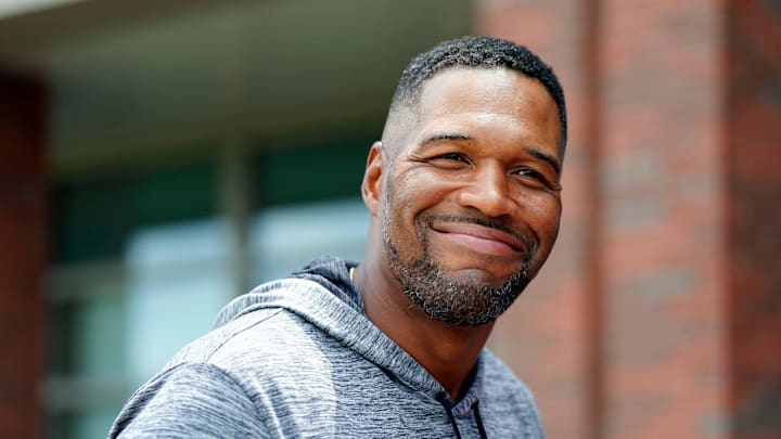 NFL legend Michael Strahan greets reporters after the first day of mandatory minicamp at the New York Giants training center in East Rutherford, New Jersey. NFL legend Michael Strahan greets reporters after the first day of mandatory minicamp at the New York Giants training center in East Rutherford, New Jersey.
