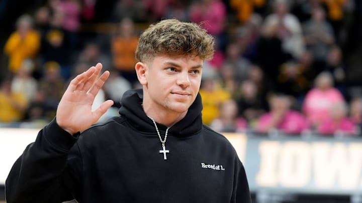 Former Iowa football player and Super Bowl LIX champion Cooper DeJean is interviewed on court during halftime of the Iowa women’s basketball game against UCLA Sunday, Feb. 23, 2025 at Carver-Hawkeye Arena in Iowa City, Iowa.
