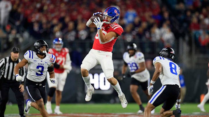 Mississippi Rebels tight end Caden Prieskorn (86) hauls in a reception between Duke Blue Devils linebacker Alex Howard (3) and safety DaShawn Stone (8) during the first quarter of the TaxSlayer Gator Bowl Thursday, Jan. 2, 2025 at EverBank Stadium in Jacksonville, Fla. [Corey Perrine/Florida Times-Union]