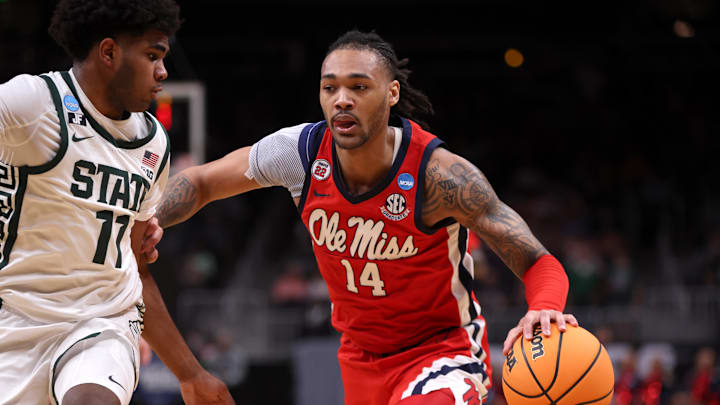 Mar 28, 2025; Atlanta, GA, USA; Mississippi Rebels guard Dre Davis (14) dribbles against Michigan State Spartans guard Jase Richardson (11) in the first half of a South Regional semifinal of the 2025 NCAA tournament at State Farm Arena. Mandatory Credit: Brett Davis-Imagn Images