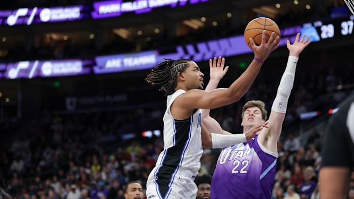 Orlando Magic guard Jett Howard shoots the ball against Utah Jazz forward Kyle Filipowski.