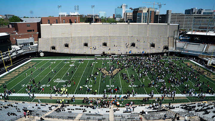 Vanderbilt fans and family gather on the field after the Vanderbilt Football Black and Gold Spring Game at FirstBank Stadium in Nashville, Tenn., Saturday, April 12, 2025.