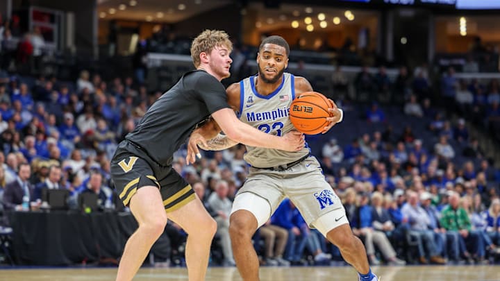 Dec 17, 2025; Memphis, Tennessee, USA; Memphis Tigers guard Sincere Parker (23) drives against Vanderbilt Commodores guard Tyler Nickel (5) during the second half at FedExForum. Mandatory Credit: Wesley Hale-Imagn Images Dec 17, 2025; Memphis, Tennessee, USA; Memphis Tigers guard Sincere Parker (23) drives against Vanderbilt Commodores guard Tyler Nickel (5) during the second half at FedExForum. Mandatory Credit: Wesley Hale-Imagn Images