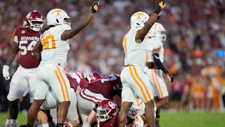 Oklahoma Sooners running back Jovantae Barnes (2) looks up as Tennessee Volunteers defensive lineman Dominic Bailey (90) and linebacker Arion Carter (7) celebrate after a defensive stop during a college football game between the University of Oklahoma Sooners (OU) and the Tennessee Volunteers at Gaylord Family - Oklahoma Memorial Stadium in Norman, Okla., Saturday, Sept. 21, 2024. Oklahoma Sooners running back Jovantae Barnes (2) looks up as Tennessee Volunteers defensive lineman Dominic Bailey (90) and linebacker Arion Carter (7) celebrate after a defensive stop during a college football game between the University of Oklahoma Sooners (OU) and the Tennessee Volunteers at Gaylord Family - Oklahoma Memorial Stadium in Norman, Okla., Saturday, Sept. 21, 2024.