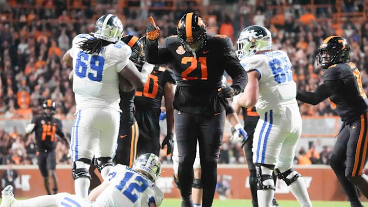 Nov 2, 2024; Knoxville, Tennessee, USA; Tennessee Volunteers defensive lineman Omari Thomas (21) celebrates a sack against the Kentucky Wildcats during the first half at Neyland Stadium. Mandatory Credit: Caitie McMekin/USA TODAY Network via Imagn Images