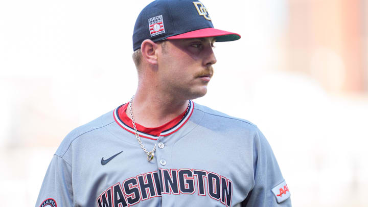 Jul 26, 2025; Minneapolis, Minnesota, USA; Washington Nationals starting pitcher Mitchell Parker (70) exits the field after retiring the Minnesota Twins in the first inning at Target Field. 