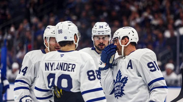 Feb 25, 2026; Tampa, Florida, USA; Toronto Maple Leafs forward Auston Matthews (34), defenseman Morgan Rielly (44), forward William Nylander (88), and forward John Tavares (91) huddle before a face-off against the Tampa Bay Lightning during the second period at Benchmark International Arena. Mandatory Credit: Morgan Tencza-Imagn Images Feb 25, 2026; Tampa, Florida, USA; Toronto Maple Leafs forward Auston Matthews (34), defenseman Morgan Rielly (44), forward William Nylander (88), and forward John Tavares (91) huddle before a face-off against the Tampa Bay Lightning during the second period at Benchmark International Arena. Mandatory Credit: Morgan Tencza-Imagn Images