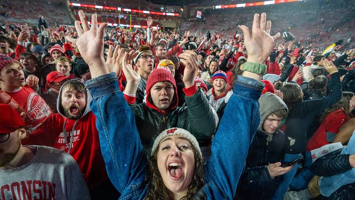 Wisconsin football fans storm the field after their team beat #23 Washington Saturday, November 8, 2025 at Camp Randall Stadium in Madison, Wisconsin. Wisconsin beat Washington 13-10.