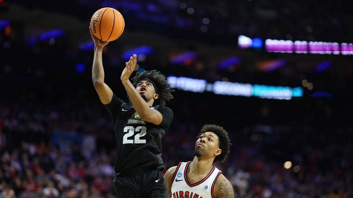 Mar 20, 2026; Philadelphia, PA, USA; Wright State Raiders guard TJ Burch (22) takes a shot as Virginia Cavaliers guard Malik Thomas (1) defends during the second half during a first round game of the men's 2026 NCAA Tournament at Xfinity Mobile Arena. Mandatory Credit: Bill Streicher-Imagn Images Mar 20, 2026; Philadelphia, PA, USA; Wright State Raiders guard TJ Burch (22) takes a shot as Virginia Cavaliers guard Malik Thomas (1) defends during the second half during a first round game of the men's 2026 NCAA Tournament at Xfinity Mobile Arena. Mandatory Credit: Bill Streicher-Imagn Images
