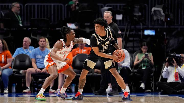 Mar 11, 2026; Charlotte, NC, USA; Wake Forest Demon Deacons guard Sebastian Akins (10) handles the ball against Clemson Tigers guard Jestin Porter (1) during the first half at Spectrum Center. Mandatory Credit: Jim Dedmon-Imagn Images