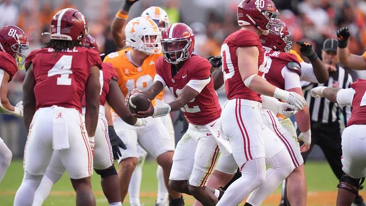 Alabama quarterback Keelon Russell (12) hands the ball off during a game between Tennessee and Alabama in Neyland Stadium in Knoxville, Tenn., Oct. 17, 2026.