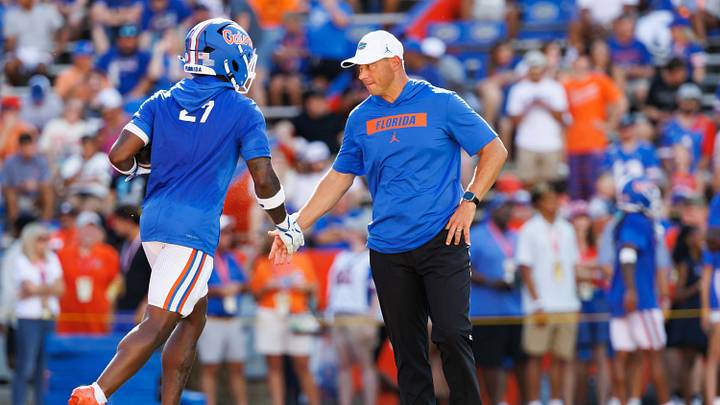 Sep 12, 2026; Gainesville, Florida, USA; Florida Gators running back Byron Louis (27) and Florida Gators head coach Jon Sumrall embrace before a game against the Campbell Fighting Camels at Ben Hill Griffin Stadium. Mandatory Credit: Matt Pendleton-Imagn Images Sep 12, 2026; Gainesville, Florida, USA; Florida Gators running back Byron Louis (27) and Florida Gators head coach Jon Sumrall embrace before a game against the Campbell Fighting Camels at Ben Hill Griffin Stadium. Mandatory Credit: Matt Pendleton-Imagn Images