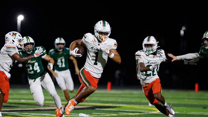 Mandarin’s Brysen Wright (1) rushes for yards during the first quarter of a high school football matchup at Nease High School on Friday, Sept. 11, 2026, in Ponte Vedra Beach, Fla. Mandarin defeated Nease 32-14.