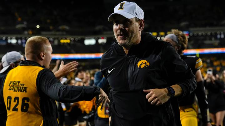 Iowa Hawkeyes offensive coordinator Tim Lester runs off the field after the football game against the Penn State Nittany Lions Oct. 18, 2025 at Kinnick Stadium in Iowa City, Iowa.
