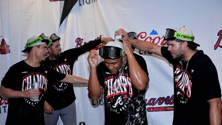 Sep 20, 2026; Houston, Texas, USA;  Atlanta Braves players and coaches celebrate in the clubhouse after winning the National League East division title at Daikin Park.  Mandatory Credit: Erik Williams-Imagn Images