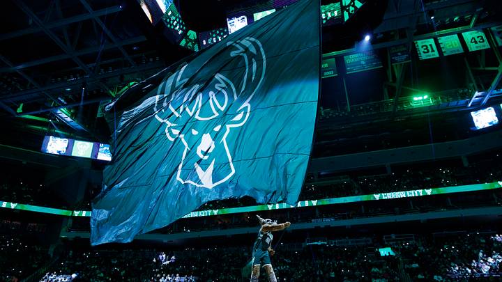 Dec 11, 2023; Milwaukee, Wisconsin, USA; Milwaukee Bucks mascot Bango waves flag with the Milwaukee Bucks logo prior to the game against the Chicago Bulls at Fiserv Forum. Mandatory Credit: Jeff Hanisch-USA TODAY Sports Dec 11, 2023; Milwaukee, Wisconsin, USA; Milwaukee Bucks mascot Bango waves flag with the Milwaukee Bucks logo prior to the game against the Chicago Bulls at Fiserv Forum. Mandatory Credit: Jeff Hanisch-USA TODAY Sports
