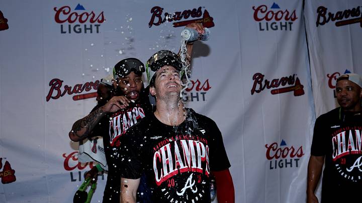Houston, Texas, USA;  Atlanta Braves outfielder Mike Yastrzemski (18) celebrates in the clubhouse after winning the National League East division title at Daikin Park.  Mandatory Credit: Erik Williams-Imagn Images
