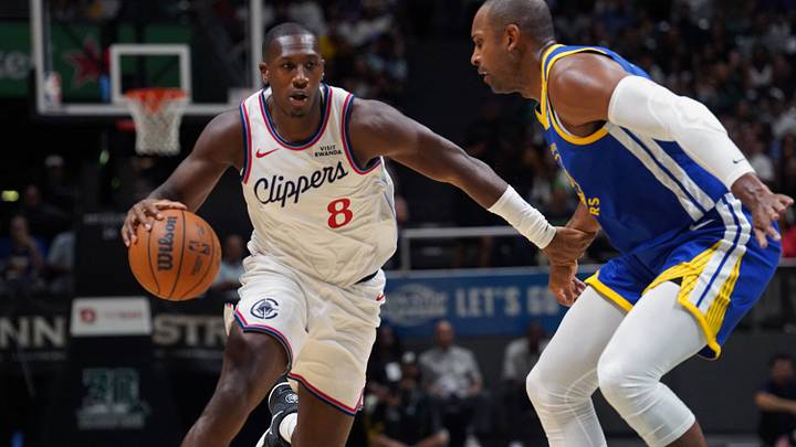 Oct 4, 2026; Honolulu, Hawaii, USA; Los Angeles Clippers guard Kris Dunn (8) drives against Golden State Warriors forward Al Horford (20) during the first half at Bankoh Arena at the Stan Sheriff Center. Mandatory Credit: Michelle Bir-Imagn Images Oct 4, 2026; Honolulu, Hawaii, USA; Los Angeles Clippers guard Kris Dunn (8) drives against Golden State Warriors forward Al Horford (20) during the first half at Bankoh Arena at the Stan Sheriff Center. Mandatory Credit: Michelle Bir-Imagn Images