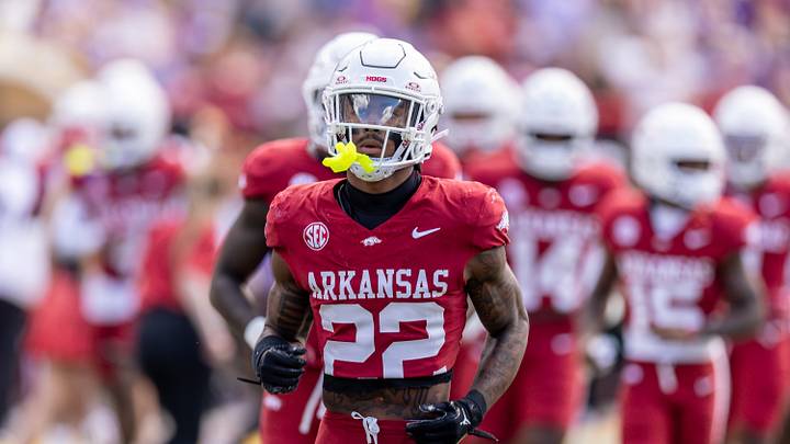 Nov 15, 2025; Baton Rouge, Louisiana, USA; Arkansas Razorbacks defensive back Caleb Wooden (22) looks on against the LSU Tigers during the first half at Tiger Stadium. Mandatory Credit: Stephen Lew-Imagn Images Nov 15, 2025; Baton Rouge, Louisiana, USA; Arkansas Razorbacks defensive back Caleb Wooden (22) looks on against the LSU Tigers during the first half at Tiger Stadium. Mandatory Credit: Stephen Lew-Imagn Images