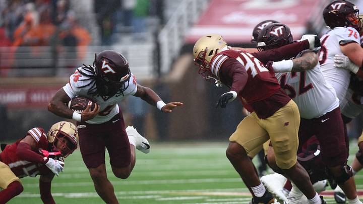 Sep 26, 2026; Chestnut Hill, Massachusetts, USA; Virginia Tech Hokies running back Jeffrey Overton, Jr. (16) breaks a tackle on Boston College defensive back Ashton Cunningham (14) in the first half at Alumni Stadium. Mandatory Credit: Edward Finan-Imagn Images Sep 26, 2026; Chestnut Hill, Massachusetts, USA; Virginia Tech Hokies running back Jeffrey Overton, Jr. (16) breaks a tackle on Boston College defensive back Ashton Cunningham (14) in the first half at Alumni Stadium. Mandatory Credit: Edward Finan-Imagn Images