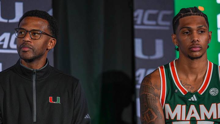 Oct 7, 2026; Charlotte, NC, USA; Miami Hurricanes head coach Jai Lucas and Acaden Lewis (55) listen to Shelton Henderson (7) answer questions from the media during the ACC Tip-Off in Charlotte, NC. Mandatory Credit: Jim Dedmon-Imagn Images Oct 7, 2026; Charlotte, NC, USA; Miami Hurricanes head coach Jai Lucas and Acaden Lewis (55) listen to Shelton Henderson (7) answer questions from the media during the ACC Tip-Off in Charlotte, NC. Mandatory Credit: Jim Dedmon-Imagn Images