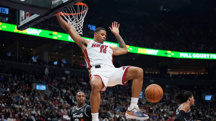 Miami Heat forward Keshad Johnson (16) reacts after dunking the ball against Toronto Raptors forward RJ Barrett (9) during the first half at Scotiabank Arena. Miami Heat forward Keshad Johnson (16) reacts after dunking the ball against Toronto Raptors forward RJ Barrett (9) during the first half at Scotiabank Arena.