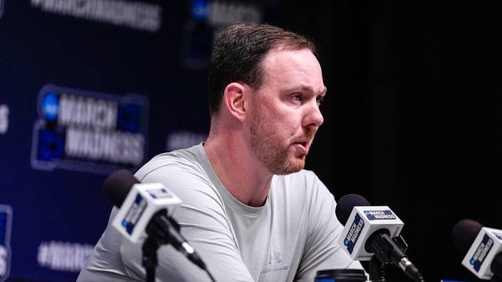 Mar 18, 2026; Greenville, SC, USA; Siena Saints head coach Gerry McNamara answers questions during a practice session ahead of the first round of the men's 2026 NCAA Tournament at Bon Secours Wellness Arena. Mandatory Credit: Jim Dedmon-Imagn Images Mar 18, 2026; Greenville, SC, USA; Siena Saints head coach Gerry McNamara answers questions during a practice session ahead of the first round of the men's 2026 NCAA Tournament at Bon Secours Wellness Arena. Mandatory Credit: Jim Dedmon-Imagn Images