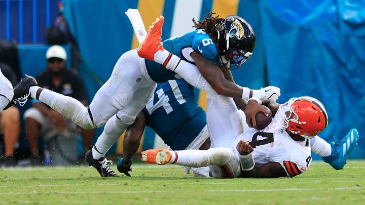 Jacksonville Jaguars safety Antonio Johnson (6) tackles Cleveland Browns quarterback Deshaun Watson (4) during the fourth quarter of an NFL football matchup at EverBank Stadium on Sunday, Sept. 13, 2026, in Jacksonville, Fla. The Jaguars defeated the Browns 34-10. [Corey Perrine/Florida Times-Union]