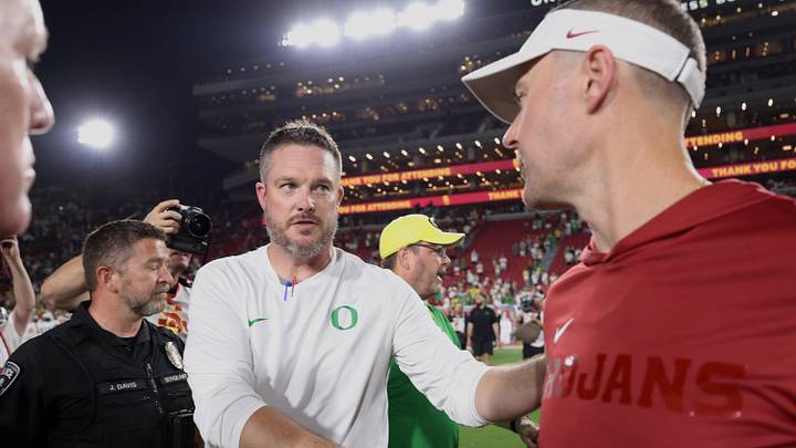 Sep 26, 2026; Los Angeles, California, USA; Oregon Ducks head coach Dan Lanning (left) shakes hands with USC Trojans head coach Lincoln Riley after the game at United Airlines Field at Los Angeles Memorial Coliseum. Mandatory Credit: Kiyoshi Mio-Imagn Images Sep 26, 2026; Los Angeles, California, USA; Oregon Ducks head coach Dan Lanning (left) shakes hands with USC Trojans head coach Lincoln Riley after the game at United Airlines Field at Los Angeles Memorial Coliseum. Mandatory Credit: Kiyoshi Mio-Imagn Images