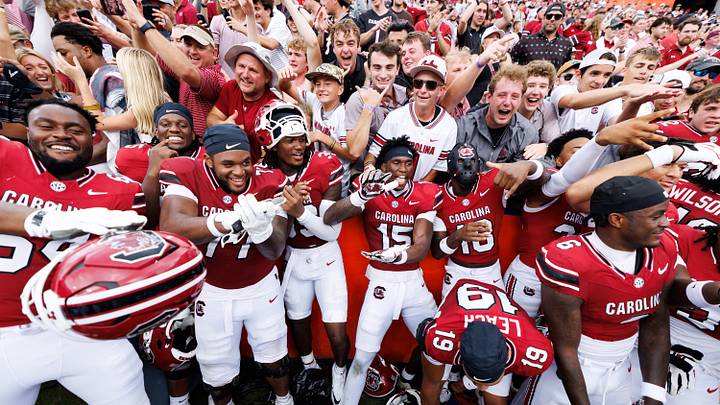 Oct 10, 2026; Gainesville, Florida, USA;  South Carolina Gamecocks linebacker Donovan Darden (15) and South Carolina Gamecocks defensive back Jaquel Holman (18) celebrate with teammates and fans after a game against the Florida Gators at Ben Hill Griffin Stadium.  Mandatory Credit: Matt Pendleton-Imagn Images