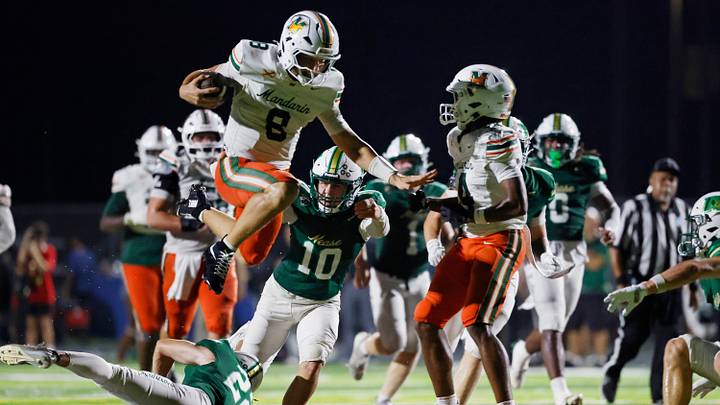 andarin quarterback Knox Annis (8) hurdles Nease's Austin Taylor (22). Annis and the undefeated Mustangs face defending Class 3A state champion Raines on Friday night. andarin quarterback Knox Annis (8) hurdles Nease's Austin Taylor (22). Annis and the undefeated Mustangs face defending Class 3A state champion Raines on Friday night.