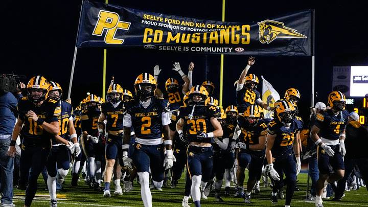 Portage Central players take the field for first half against Hudsonville at Portage Central High School in Portage on Friday, Oct. 30, 2026. Portage Central players take the field for first half against Hudsonville at Portage Central High School in Portage on Friday, Oct. 30, 2026.