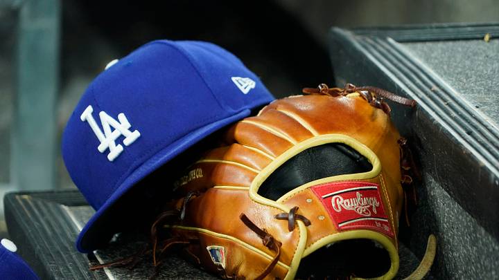 A hat and glove of an Los Angeles Dodgers player durng a game against the Toronto Blue Jays at Rogers Centre on April 28, 2024. A hat and glove of an Los Angeles Dodgers player durng a game against the Toronto Blue Jays at Rogers Centre on April 28, 2024.