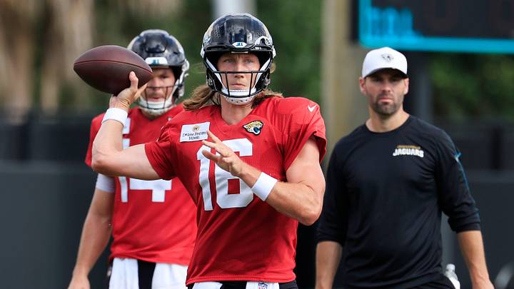 Jacksonville Jaguars quarterback Trevor Lawrence (16) looks to pass as quarterback Nick Mullens (14), left, and quarterbacks coach Spencer Whipple looks on during an NFL training camp session at the Miller Electric Center, Thursday, Aug. 14, 2025 in Jacksonville, Fla. Jacksonville Jaguars quarterback Trevor Lawrence (16) looks to pass as quarterback Nick Mullens (14), left, and quarterbacks coach Spencer Whipple looks on during an NFL training camp session at the Miller Electric Center, Thursday, Aug. 14, 2025 in Jacksonville, Fla.
