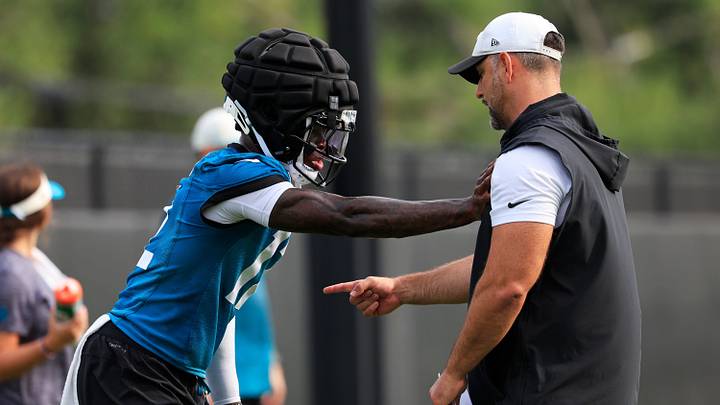Jacksonville Jaguars wide receiver/cornerback Travis Hunter (12) is helped on technique by defensive coordinator Anthony Campanile during the first day of NFL Training Camp at the Miller Electric Center on Wednesday, July 29, 2026, in Jacksonville, Fla. Jacksonville Jaguars wide receiver/cornerback Travis Hunter (12) is helped on technique by defensive coordinator Anthony Campanile during the first day of NFL Training Camp at the Miller Electric Center on Wednesday, July 29, 2026, in Jacksonville, Fla.