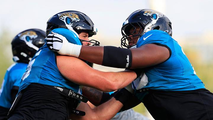 Jacksonville Jaguars guard Ezra Cleveland (76), left, drills on offensive tackle Anton Harrison (77) during the sixth day of NFL training camp at the Miller Electric Center on Tuesday, Aug. 4, 2026, in Jacksonville, Fla. Jacksonville Jaguars guard Ezra Cleveland (76), left, drills on offensive tackle Anton Harrison (77) during the sixth day of NFL training camp at the Miller Electric Center on Tuesday, Aug. 4, 2026, in Jacksonville, Fla.