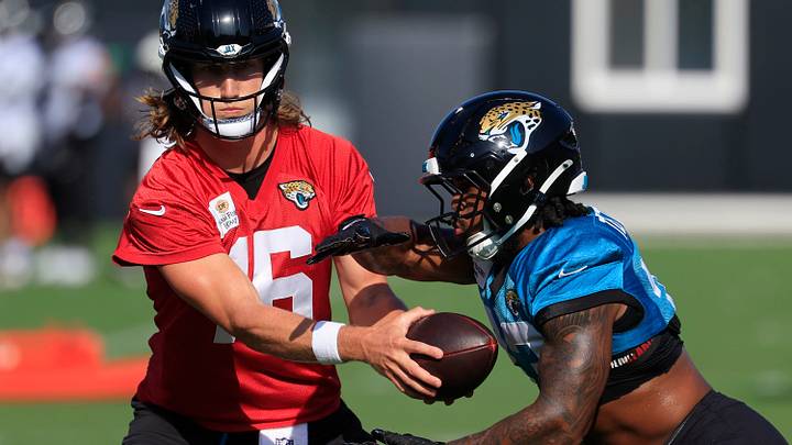 Jacksonville Jaguars quarterback Trevor Lawrence (16) hands off to running back Bhayshul Tuten (33) during Day 15 of NFL training camp at the Miller Electric Center on Tuesday, Aug. 18, 2026, in Jacksonville, Fla.