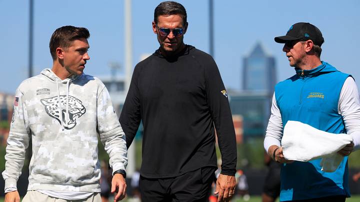 From left, Jacksonville Jaguars general manager James Gladstone, Executive Vice President of football operations Tony Boselli, head coach Liam Coen talk after Day 15 of NFL training camp at the Miller Electric Center on Tuesday, Aug. 18, 2026, in Jacksonville, Fla.
