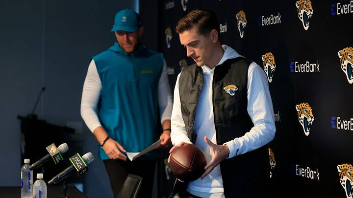 Jacksonville Jaguars general manager James Gladstone walks into the room with head coach Liam Coen following during a press conference at the Miller Electric Center, Wednesday, Jan. 14, 2026, in Jacksonville, Fla.
