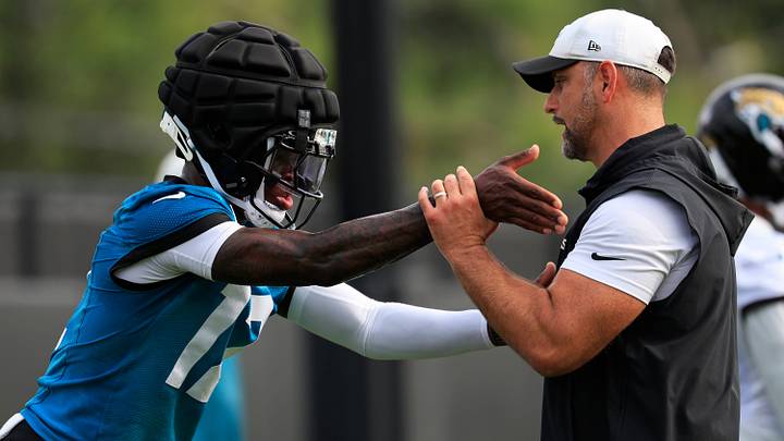 Jacksonville Jaguars wide receiver/cornerback Travis Hunter (12) is helped on technique by defensive coordinator Anthony Campanile during the first day of NFL Training Camp at the Miller Electric Center on Wednesday, July 29, 2026, in Jacksonville, Fla. Jacksonville Jaguars wide receiver/cornerback Travis Hunter (12) is helped on technique by defensive coordinator Anthony Campanile during the first day of NFL Training Camp at the Miller Electric Center on Wednesday, July 29, 2026, in Jacksonville, Fla.