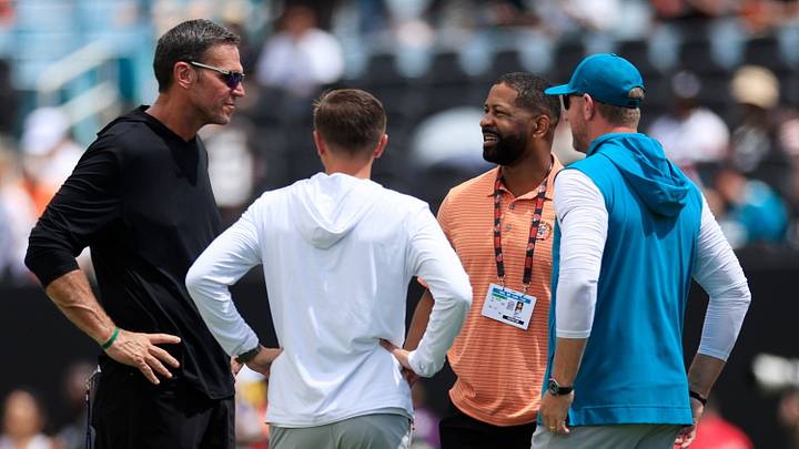 From left, Jacksonville Jaguars Executive Vice President of Football Operations Tony Boselli, General Manager James Gladstone, Cleveland Browns Executive Vice President of Football Operations and General Manager Andrew Berry and Jacksonville Jaguars head coach Liam Coen talk before an NFL football matchup at EverBank Stadium on Sunday, Sept. 13, 2026, in Jacksonville, Fla. The Jaguars defeated the Browns 34-10. [Corey Perrine/Florida Times-Union]