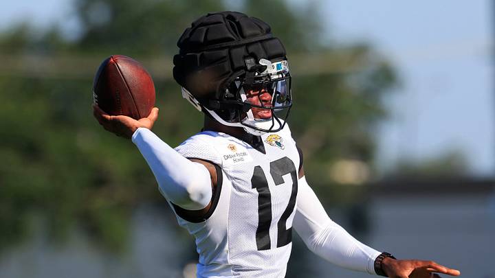 Jacksonville Jaguars wide receiver/cornerback Travis Hunter (12) tosses the ball during Day 15 of NFL training camp at the Miller Electric Center on Tuesday, Aug. 18, 2026, in Jacksonville, Fla.
