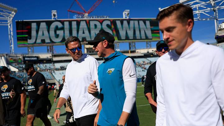 From left, Jacksonville Jaguars Executive Vice President of football operations Tony Boselli, head coach Liam Coen and general manager James Gladstone walk off the field after the game of an NFL football matchup at EverBank Stadium on Sunday, Sept. 27, 2026, in Jacksonville, Fla. The Jaguars defeated the Patriots 35-6. [Corey Perrine/Florida Times-Union]