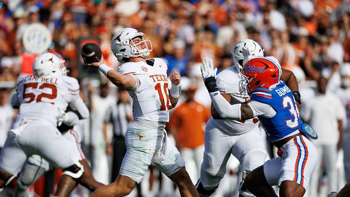 Oct 4, 2025; Gainesville, Florida, USA; Texas Longhorns quarterback Arch Manning (16) throws the ball under pressure from Florida Gators defensive end George Gumbs Jr. (34) during the first half at Ben Hill Griffin Stadium. Mandatory Credit: Matt Pendleton-Imagn Images Oct 4, 2025; Gainesville, Florida, USA; Texas Longhorns quarterback Arch Manning (16) throws the ball under pressure from Florida Gators defensive end George Gumbs Jr. (34) during the first half at Ben Hill Griffin Stadium. Mandatory Credit: Matt Pendleton-Imagn Images