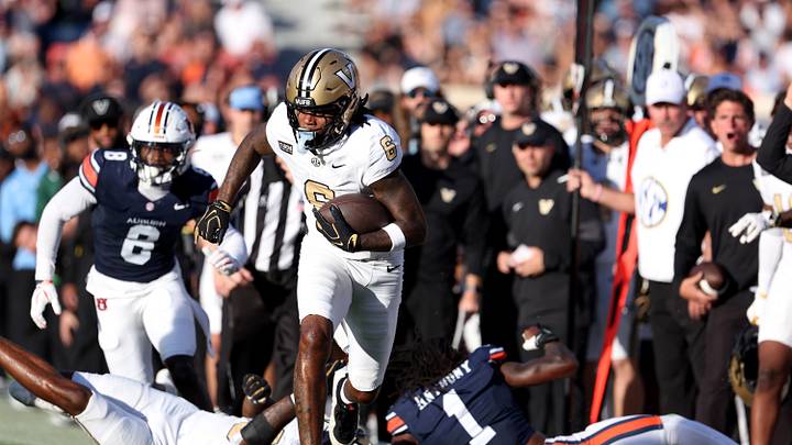 Sep 26, 2026; Auburn, Alabama, USA;  Vanderbilt Commodores wide receiver Ja'cory Thomas (6) gets past Auburn Tigers defenders during the third quarter at Jordan-Hare Stadium.  Mandatory Credit: John Reed-Imagn Images