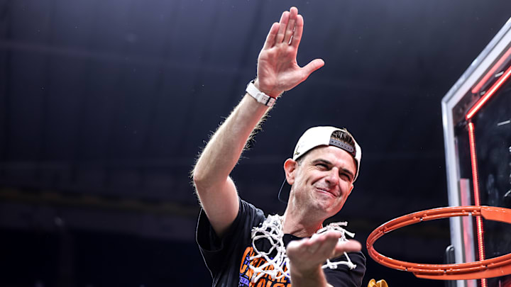 Florida Gators head coach Todd Golden chomps after leading the Florida Gators to its third championship in program history.