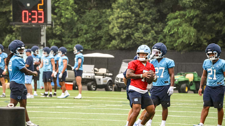North Carolina quarterback Gio Lopez dropping back to pass at practice at the Koman Practice Complex on Aug. 2, 2025.