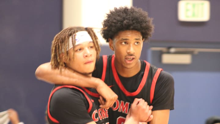 Tajh Ariza (right) embraces a teammate during the City finals.